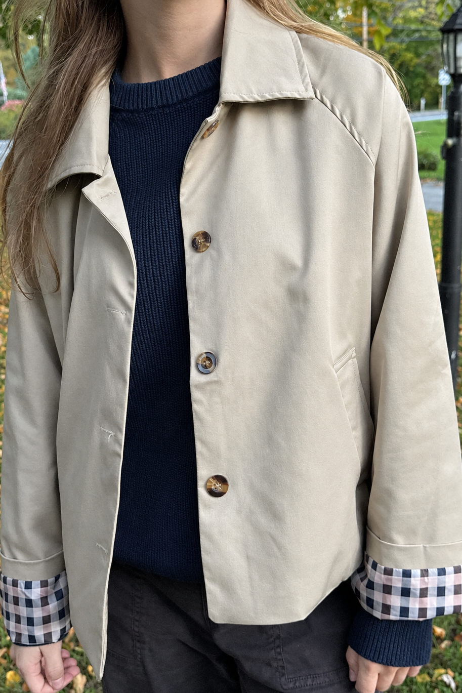 Neutral beige trench close-up preview